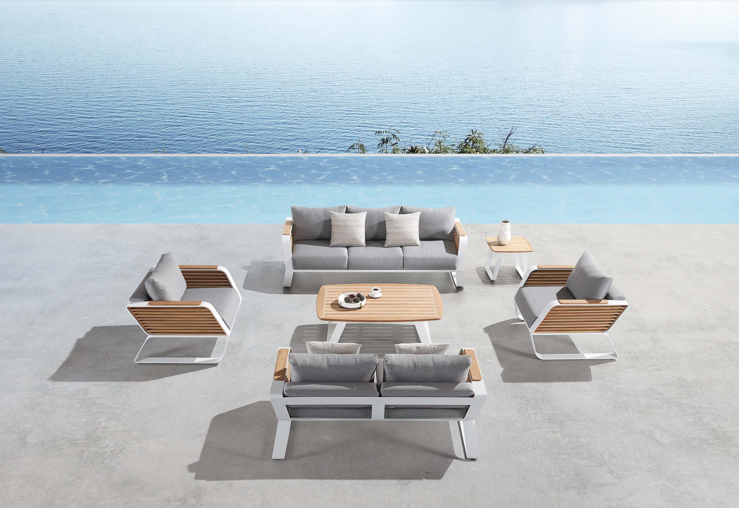 Salon de jardin luxe 7 places en aluminium blanc léger et teck FSC, design haut de gamme Pininfarina avec coussins.