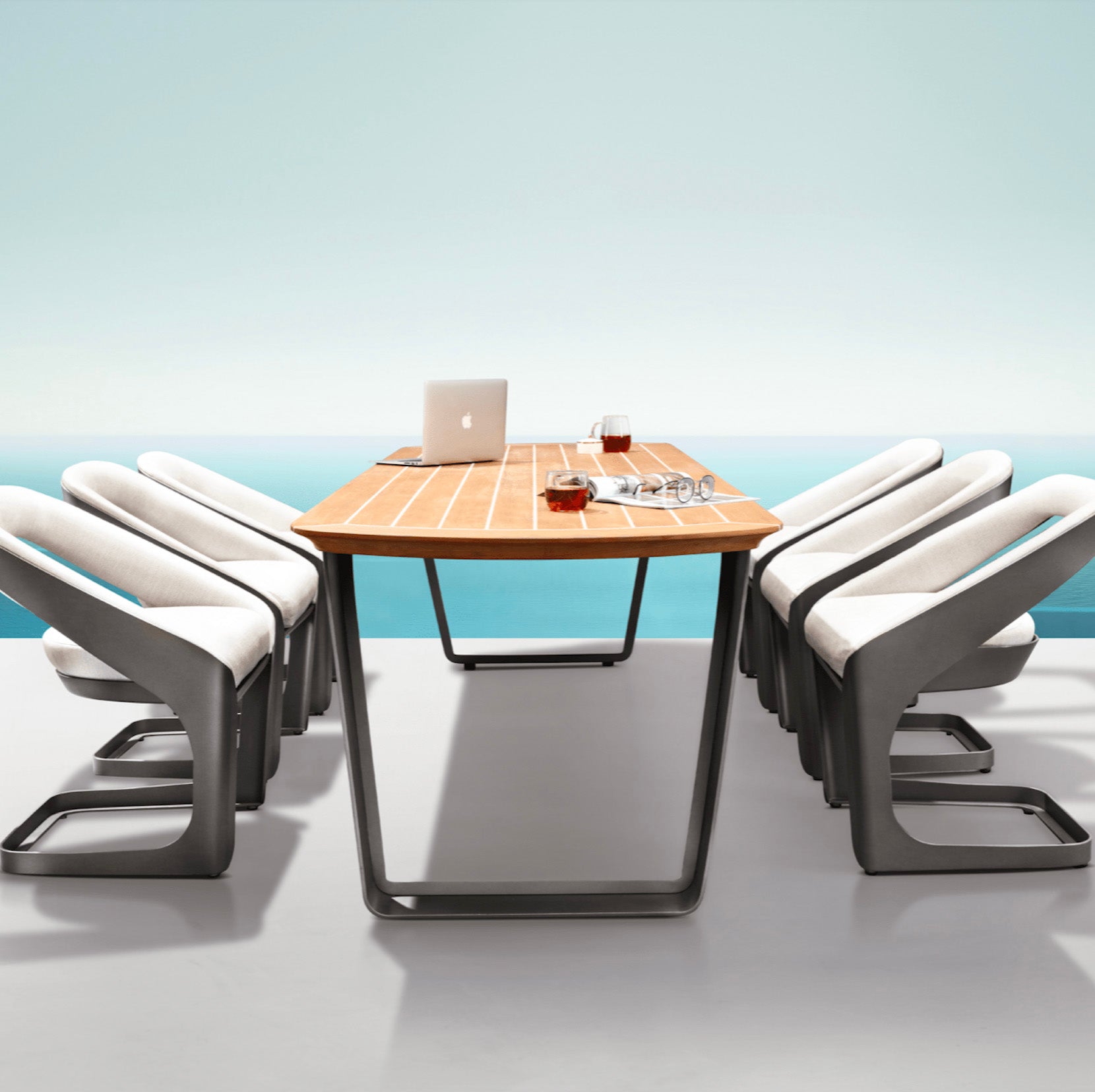 Ensemble repas luxe ONDA avec table Teck FSC à lignes courbées et chaises design PININFARINA en tissu Sunbrella gris clair. 